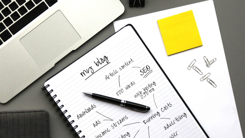 mapping out a blog with pen and paper